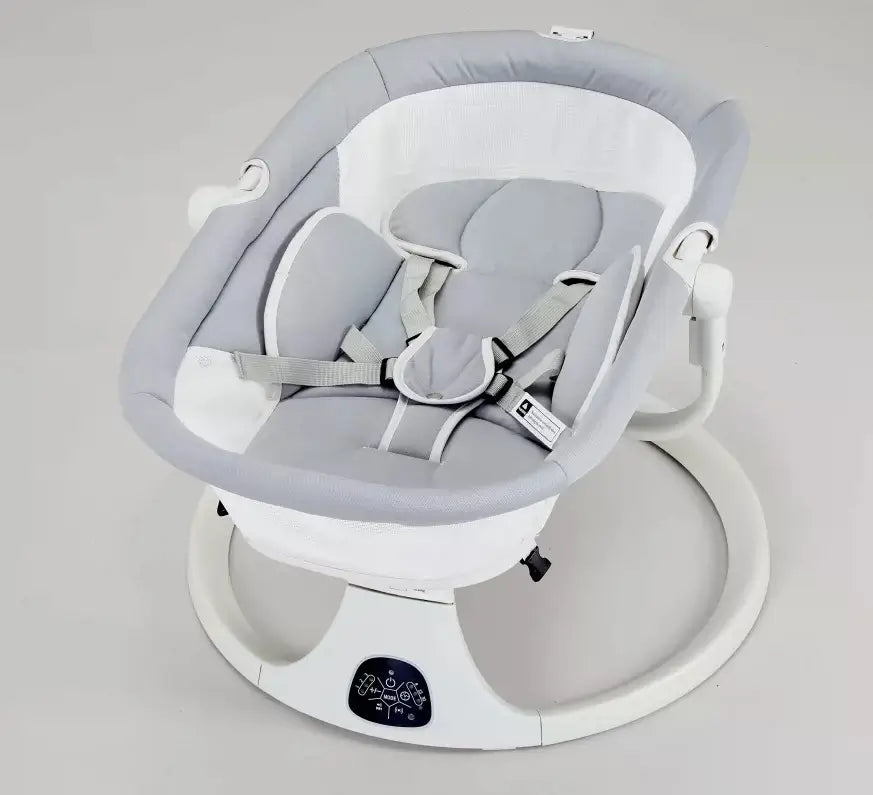 Gray baby swing on a light gray background