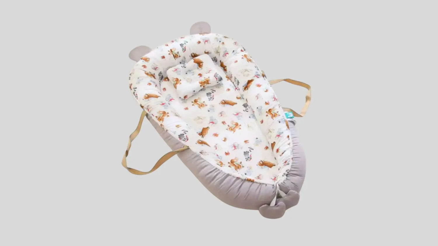 Baby nest with animal pattern on a light gray background