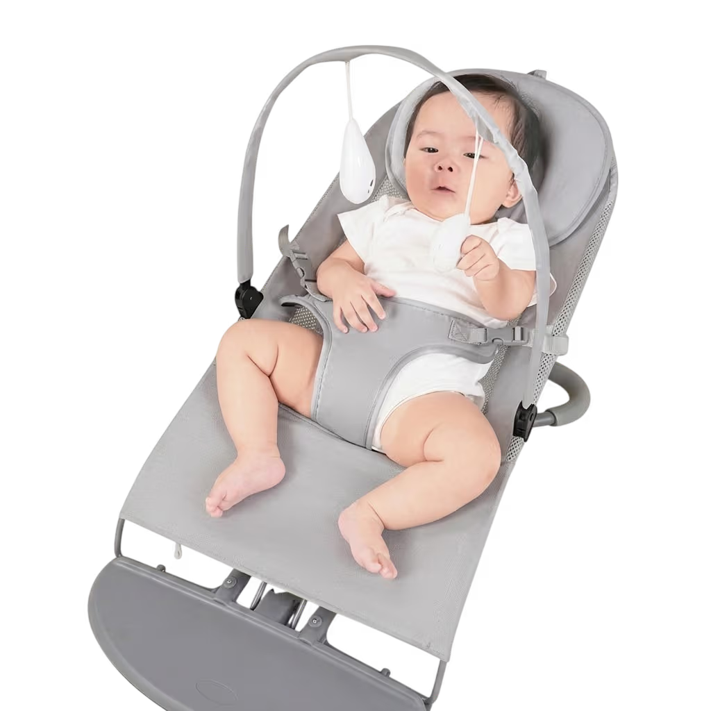 Baby in a gray baby bouncer on a white background