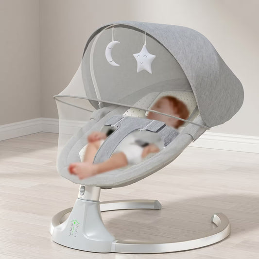 Baby in a gray baby swing with star and moon designs on a neutral background