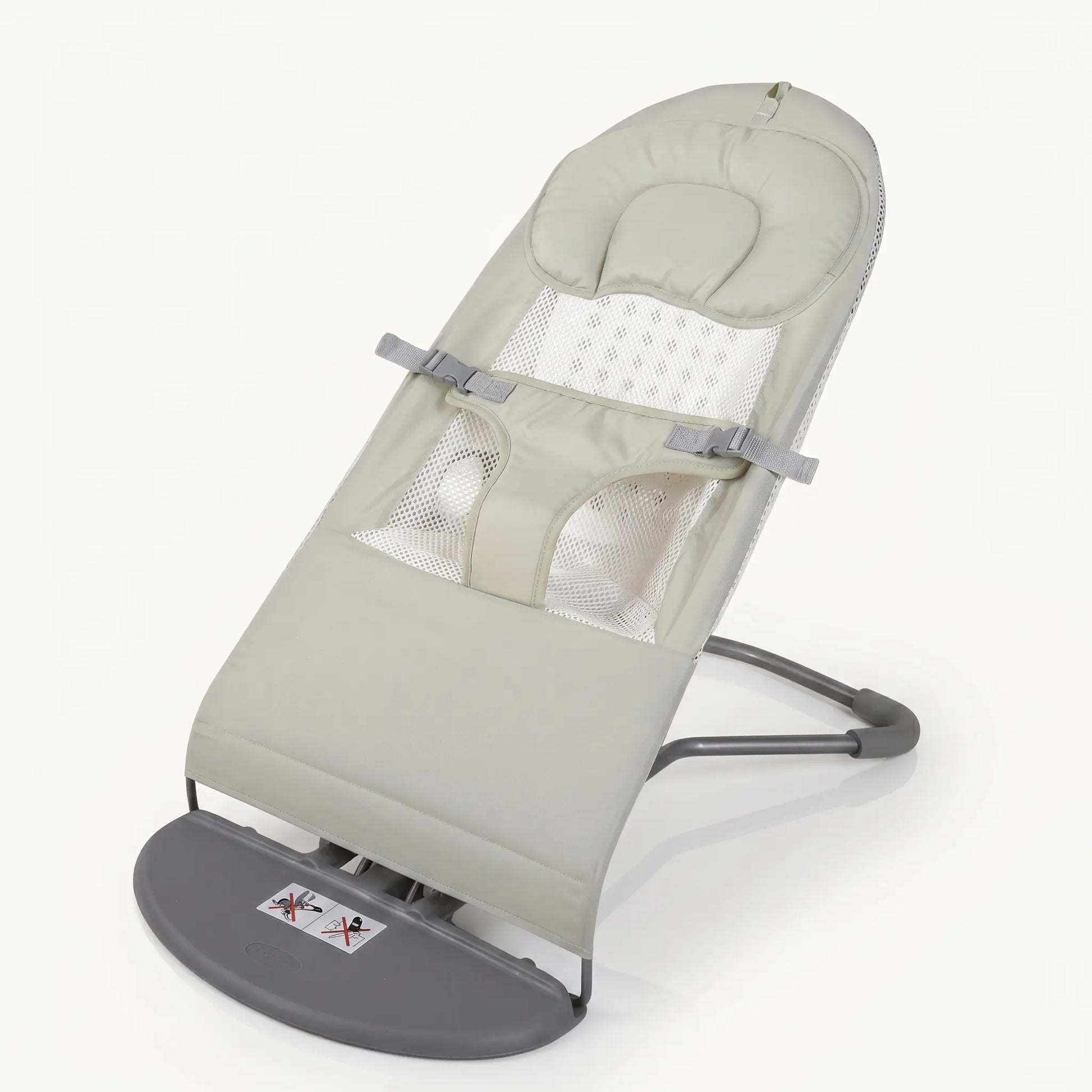 Baby bouncer with beige cushion and gray base on a white background