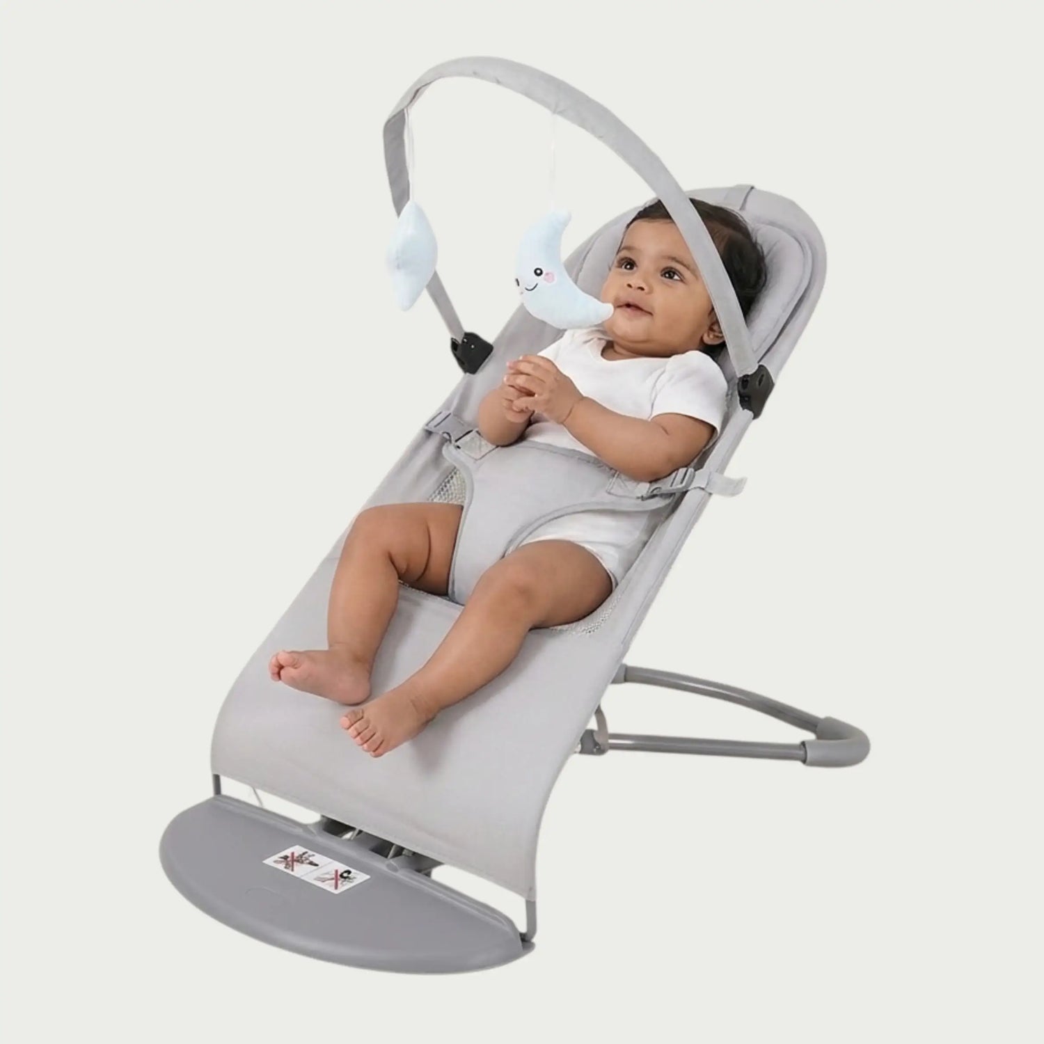 Baby in a gray baby bouncer on a white background