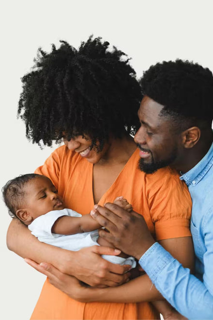 Family of three with a baby, all on a transparent background