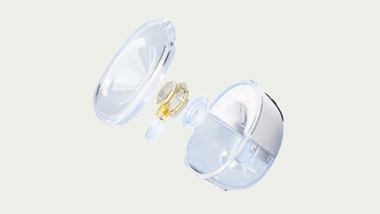 Transparent baby bottle with a white cap on a light gray background
